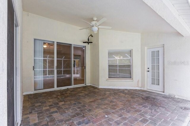 view of patio featuring ceiling fan