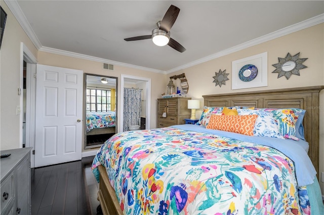 bedroom with connected bathroom, a ceiling fan, visible vents, dark wood finished floors, and crown molding