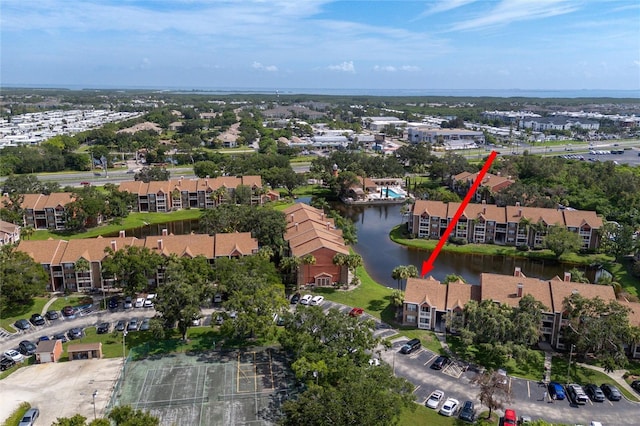 bird's eye view featuring a residential view and a water view