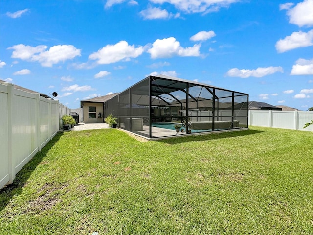 view of yard with a lanai, a fenced in pool, and a patio