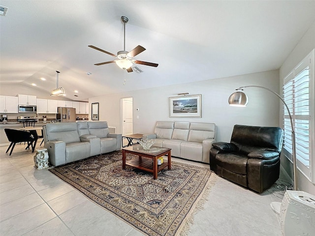 tiled living room with lofted ceiling and ceiling fan