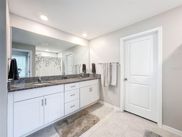 bathroom featuring vanity, tile patterned floors, and a shower with shower curtain