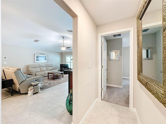 hallway featuring light tile patterned floors