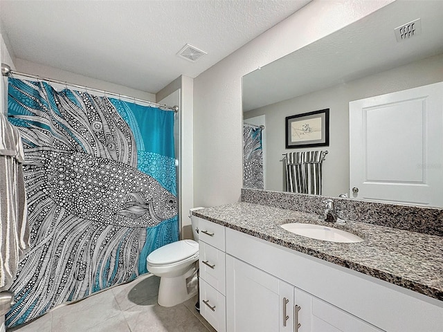 bathroom with toilet, tile patterned floors, curtained shower, a textured ceiling, and vanity