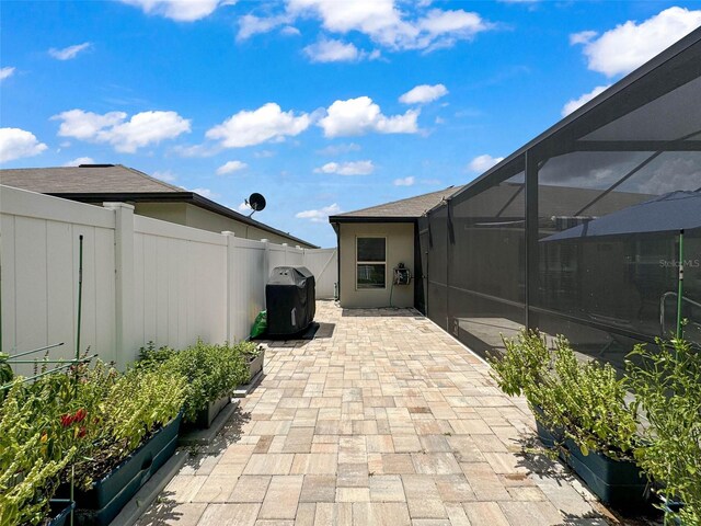 view of patio / terrace with glass enclosure