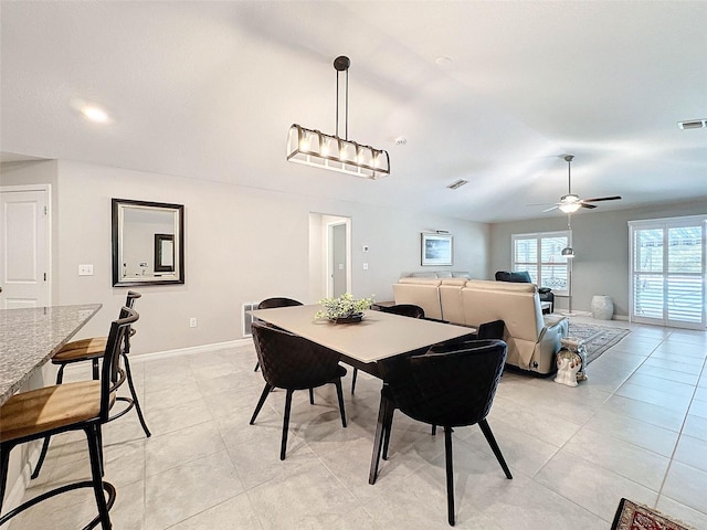 dining area featuring ceiling fan and light tile patterned floors