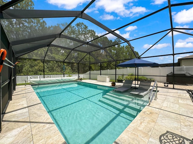 view of swimming pool featuring area for grilling, a patio area, and glass enclosure