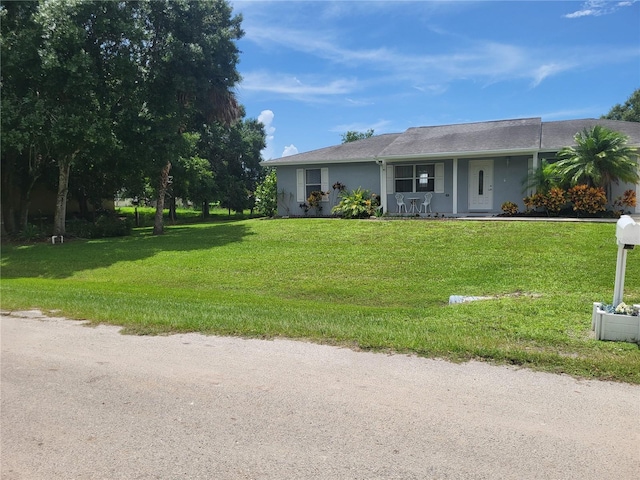 single story home with a front yard and a porch