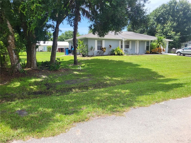 single story home featuring a front lawn and covered porch