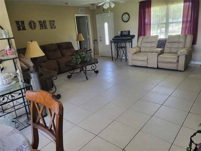 living room with ceiling fan and light tile patterned floors