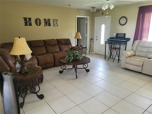 tiled living room featuring ceiling fan and plenty of natural light