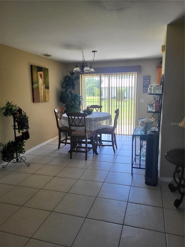 dining space featuring tile patterned floors