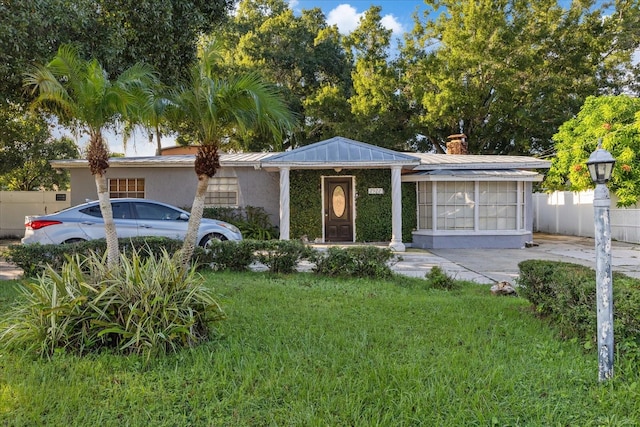 ranch-style house with a front yard