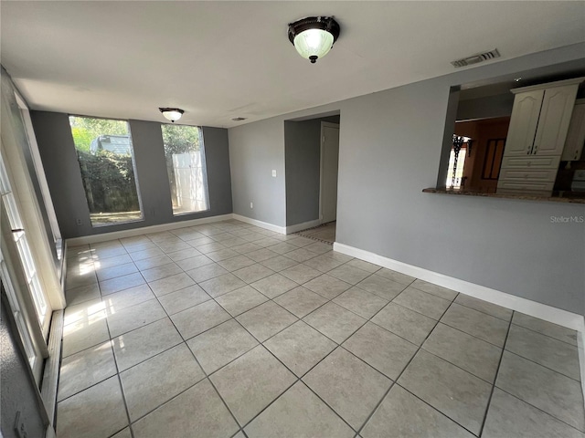 empty room featuring light tile patterned floors