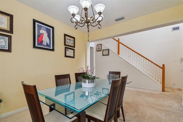 dining space with visible vents, stairway, and carpet flooring