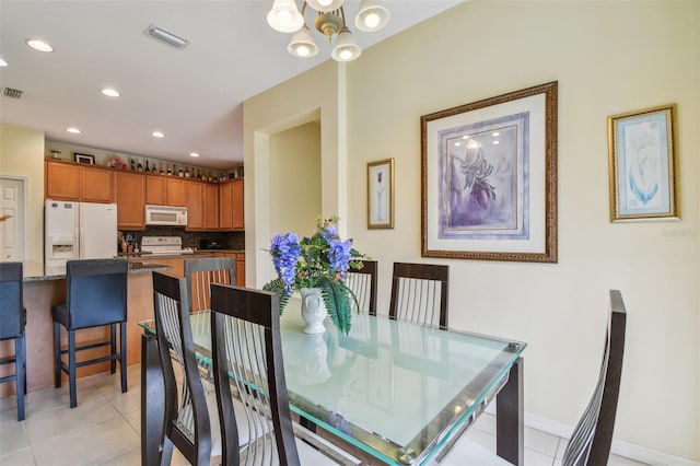 dining area with light tile patterned floors, baseboards, visible vents, and recessed lighting