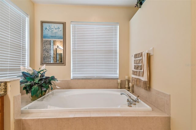 bathroom with a garden tub