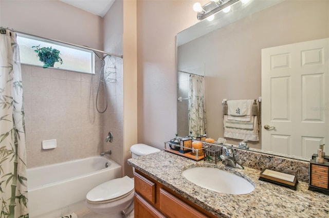 bathroom featuring shower / bathtub combination with curtain, vanity, and toilet