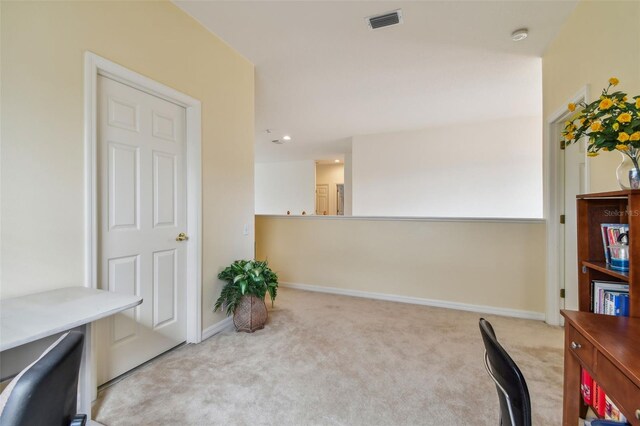 office space with carpet, visible vents, and baseboards