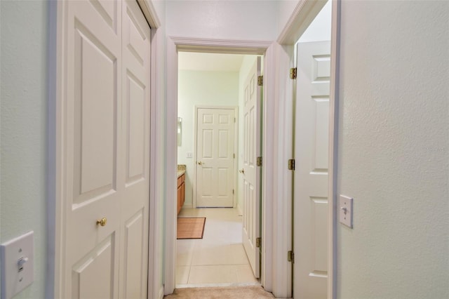 hallway featuring light tile patterned floors