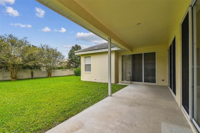 view of yard featuring a patio area and fence