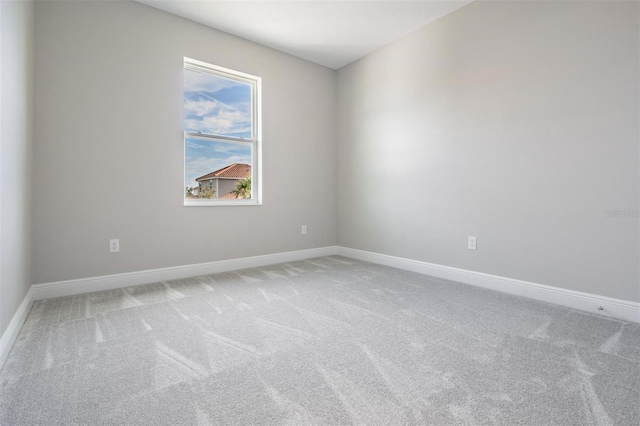 unfurnished room featuring carpet flooring