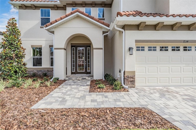 entrance to property featuring a garage