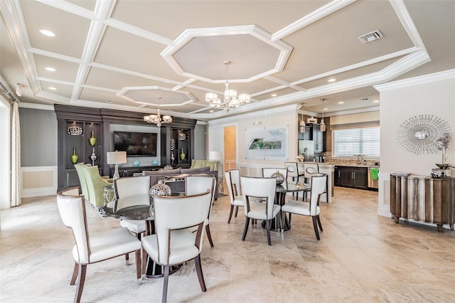 dining area featuring coffered ceiling, ornamental molding, and an inviting chandelier