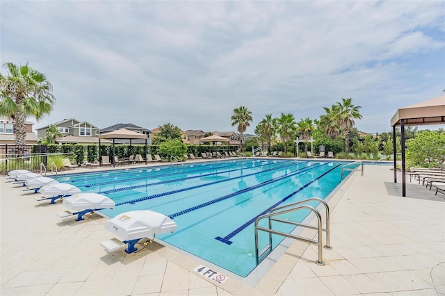 view of swimming pool with a patio area