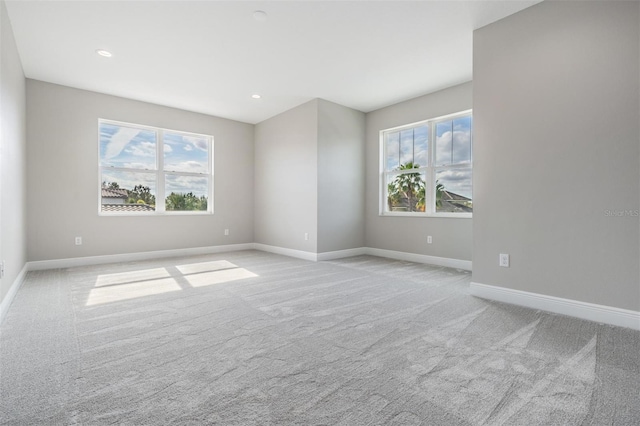 spare room with light colored carpet