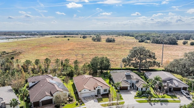 birds eye view of property with a rural view