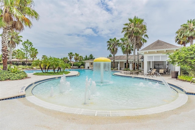 view of pool featuring a patio area and pool water feature