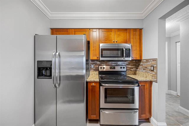 kitchen with light stone countertops, stainless steel appliances, backsplash, crown molding, and light tile patterned floors