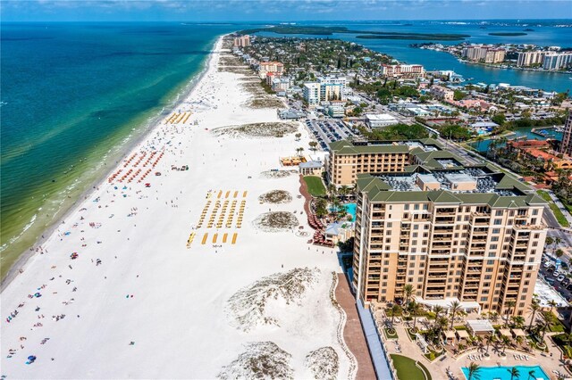 aerial view with a water view and a view of the beach