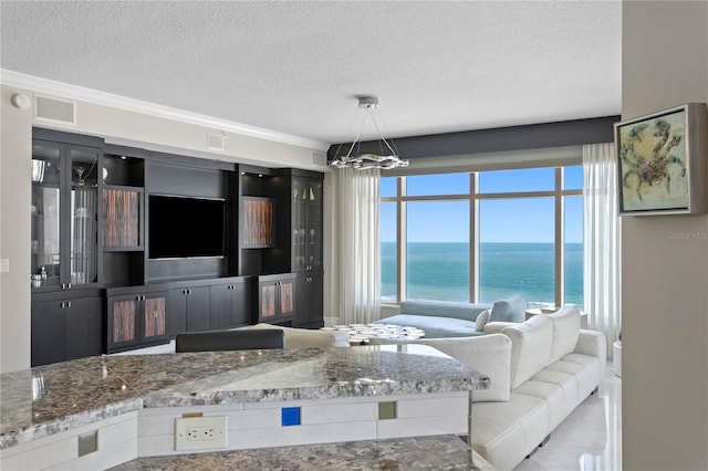 unfurnished living room featuring a textured ceiling and a notable chandelier