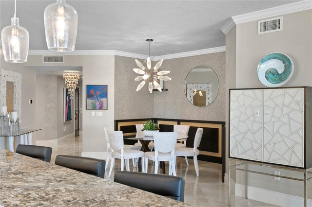 tiled dining space with a textured ceiling, a notable chandelier, and ornamental molding