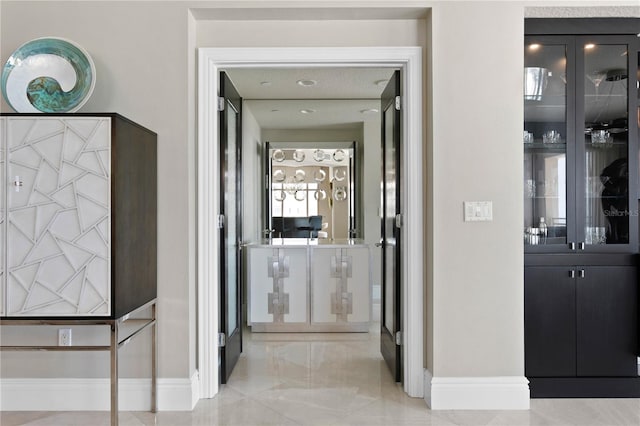 corridor featuring light tile patterned floors