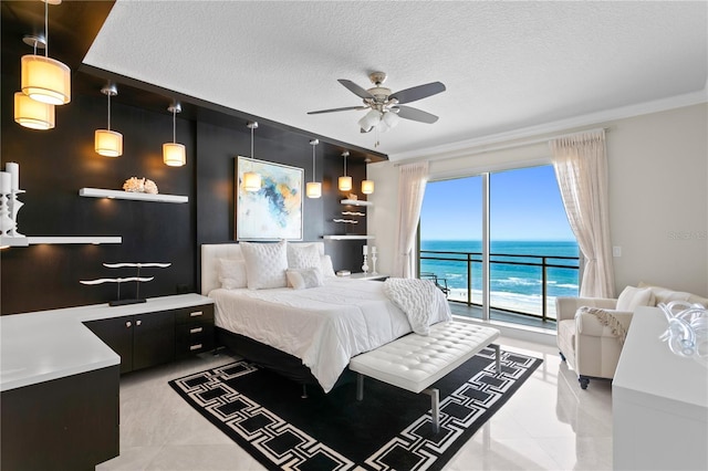 bedroom with a water view, a textured ceiling, access to outside, light tile patterned floors, and ceiling fan