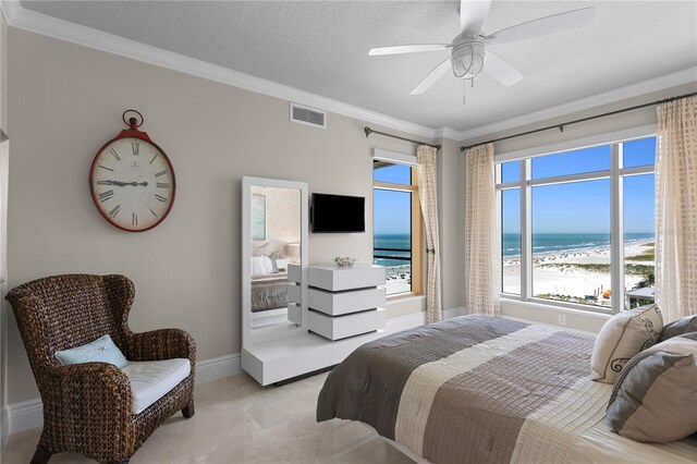 bedroom featuring a textured ceiling, ceiling fan, ornamental molding, and light carpet