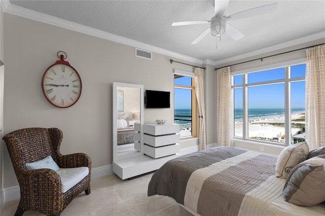 bedroom featuring baseboards, a textured ceiling, visible vents, and crown molding