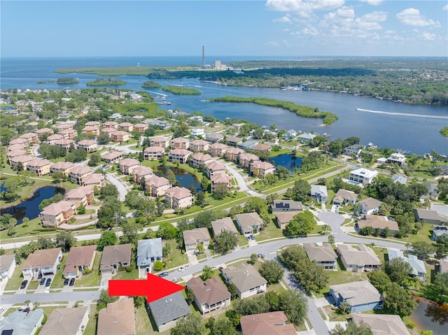 bird's eye view with a water view and a residential view