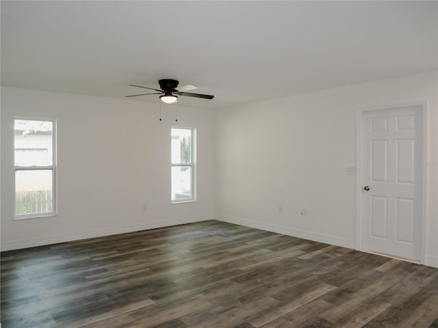 empty room with ceiling fan, wood-type flooring, and a wealth of natural light