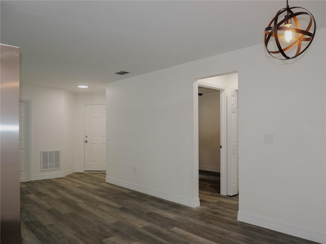 spare room featuring dark hardwood / wood-style floors