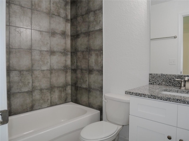 full bathroom featuring vanity, bathtub / shower combination, and toilet