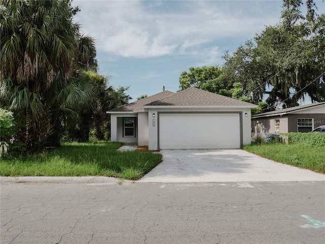 single story home featuring stucco siding, concrete driveway, a garage, and roof with shingles