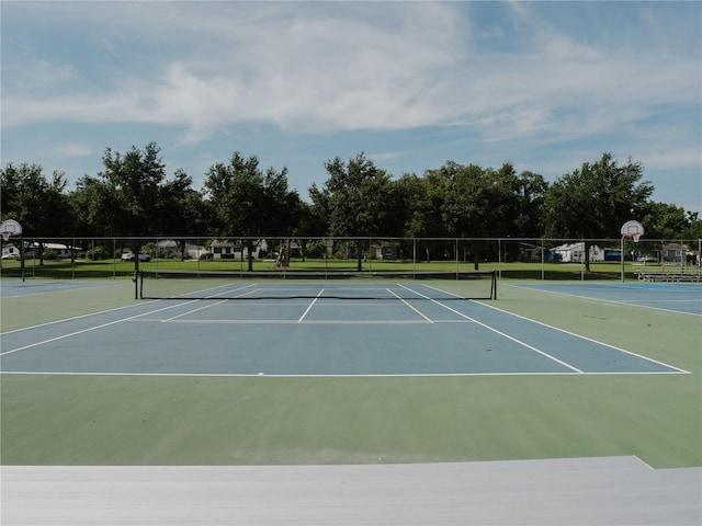 view of sport court with basketball hoop