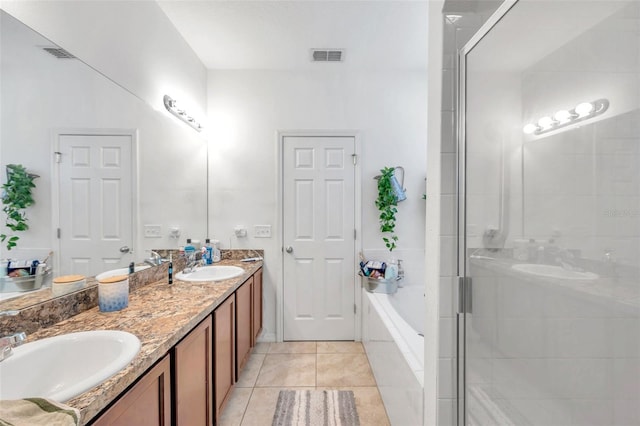 bathroom with independent shower and bath, tile patterned flooring, and vanity