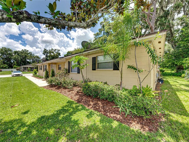 view of home's exterior with a yard