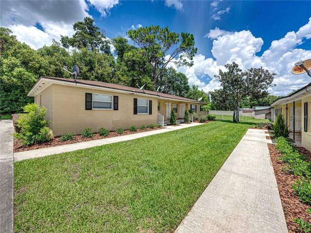 single story home featuring a front yard