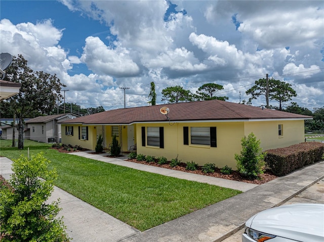 ranch-style house with a front yard